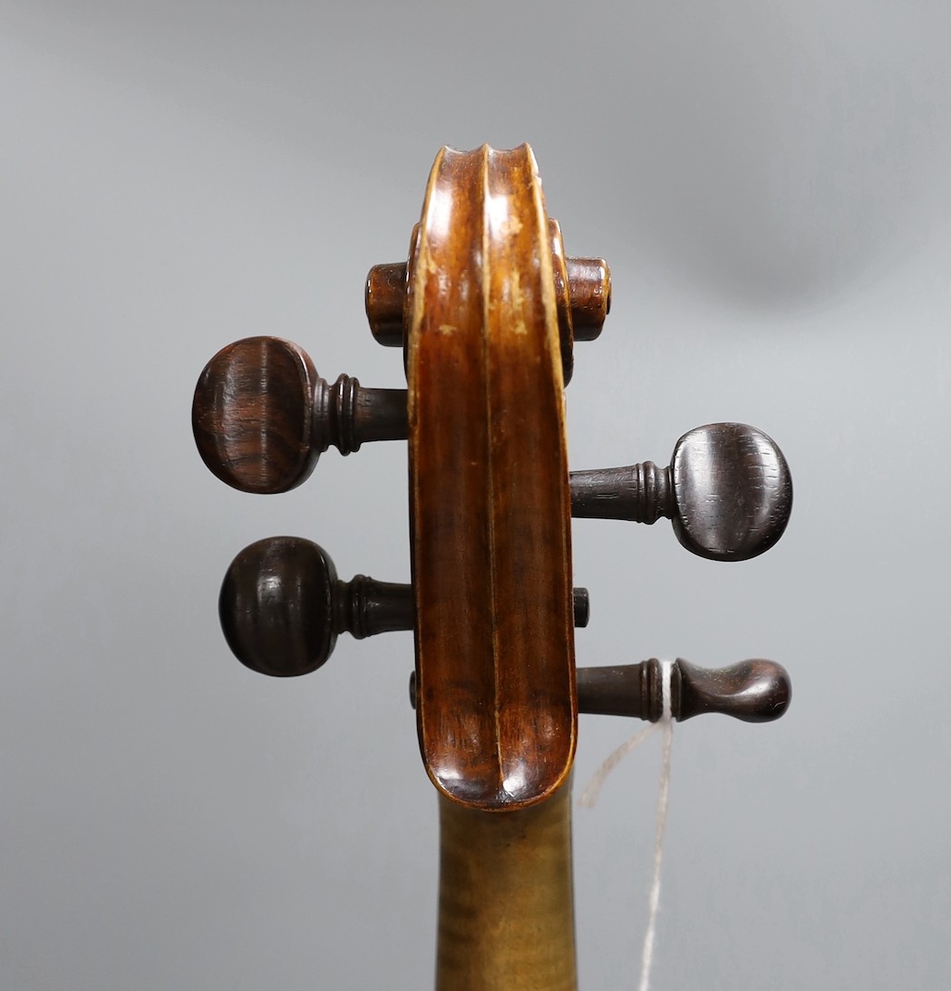 A cased late 19th century English violin, inscribed W. Heaton maker 1887 (?), back measures 35.5cm excl button
